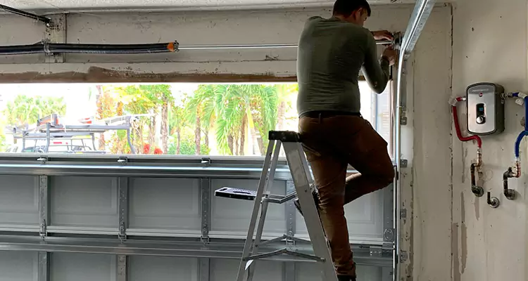 Garage Door Tension Spring Replacement in Ives Estates, FL