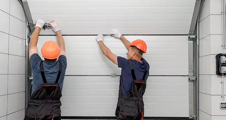 Garage Door Bottom Panel Repair in Ives Estates, FL